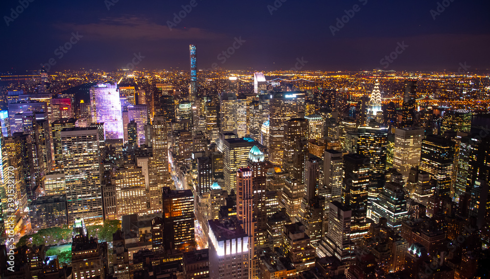 Fototapeta premium New York Manhattan skyline top view during autumn sunset with amazing colors and sights of skyscrapers