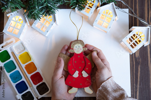 Obraz na płótnie he child paints Christmas decorations / toys for the Christmas tree. New Year's creativity with children, concept w salonie