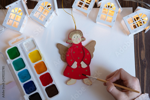 Obraz na płótnie he child paints Christmas decorations / toys for the Christmas tree. New Year's creativity with children, concept w salonie