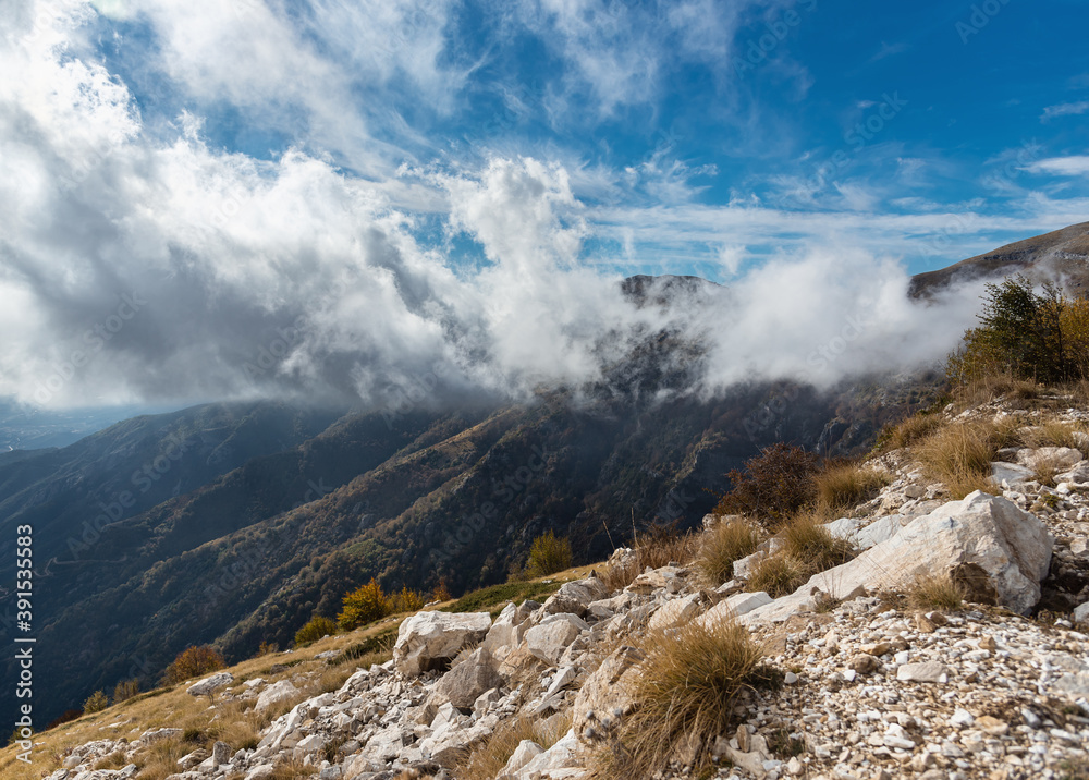 Panoramic view at spectacular landscape with white clouds wrap around beautiful mountain Paggaio. Greece