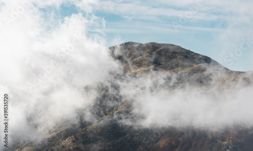 White clouds wrap around spectacular mountain Paggaio. Greece