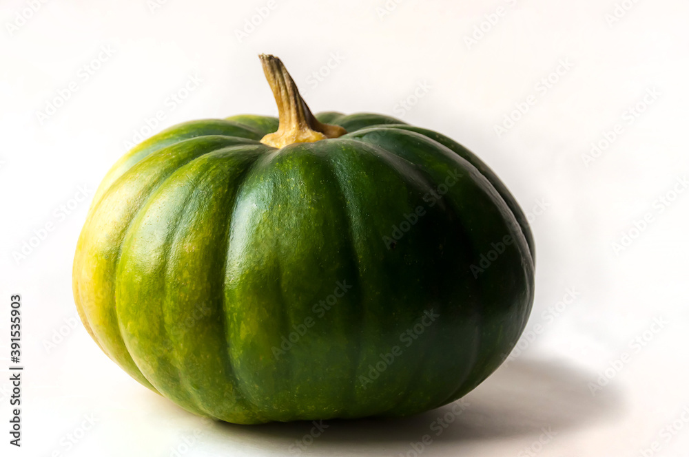 Yellow-green pumpkin on a white background. Yellow-green pumpkin on a white background.