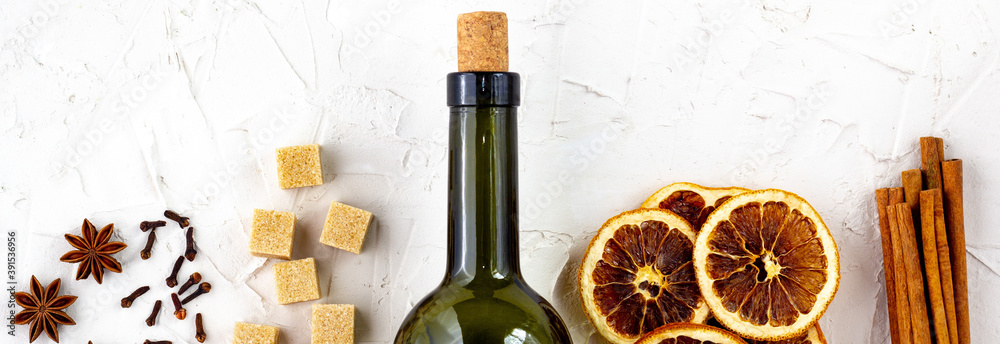 border of Bottle of wine and spice on white background. Ingredients for a mulled wine. border of Bottle of wine and spice on white background. Ingredients for a mulled wine.
