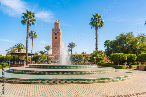 Fountain at Lalla Hasna parc with Koutoubia Mosque in the background photo
