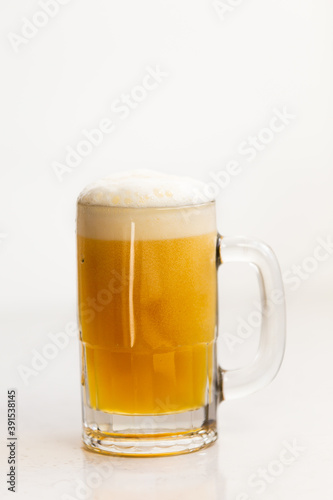 Beer with foam in mug