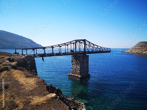 Obraz na płótnie bridge into nowhere / loading crane on the old mining island of Serifos, Greece w salonie