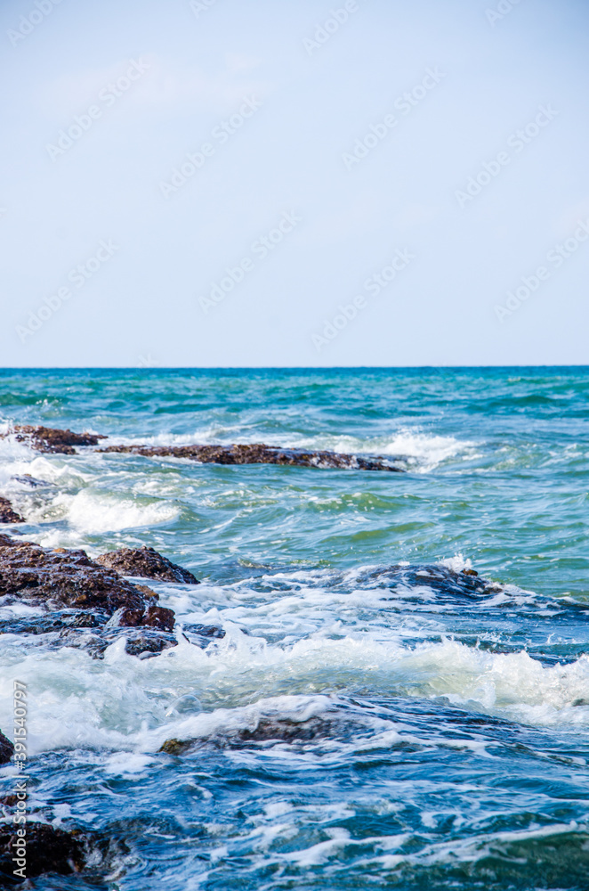Ocean waves breaking on the rocks on the shore. Ocean waves breaking on the rocks on the shore.