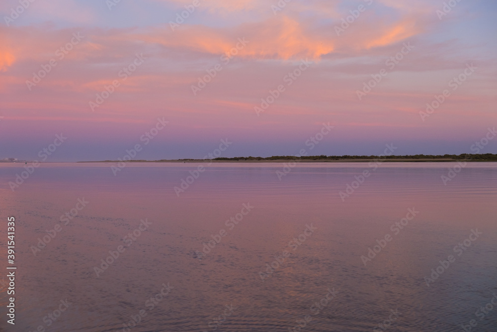 pink and purple sunset at the beach pink and purple sunset at the beach