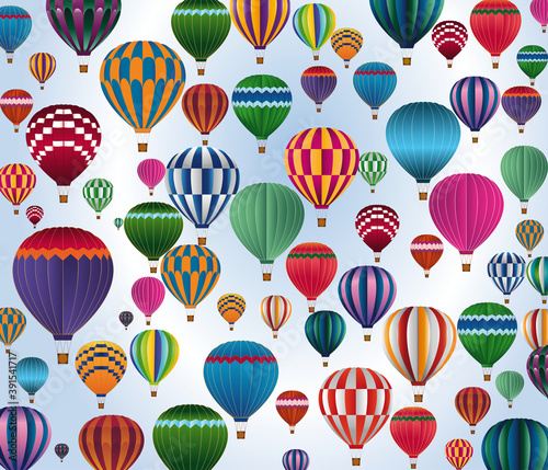 Group of colored hot-air balloons flying on a blue background
