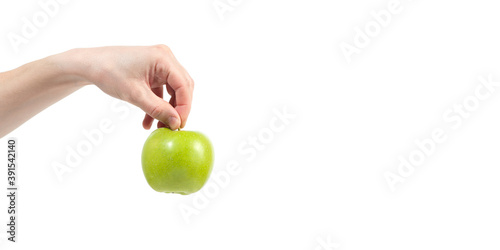 Ripe delicious juicy green apple in hand isolated on white background. Healthy eating and dieting concept. Copy space. Free space for your text