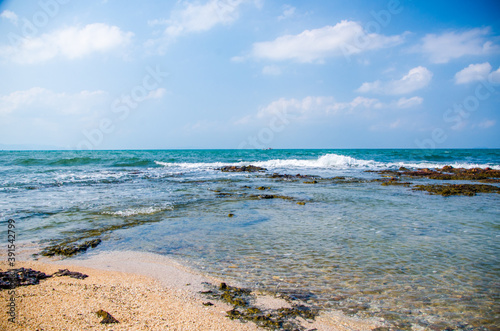 Ocean waves breaking on the rocks on the shore.