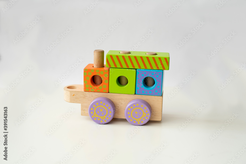 Obraz premium wooden blocks toys for children play in home and kindergarten. Cube and rectangle. different colours. constructor from wooden part