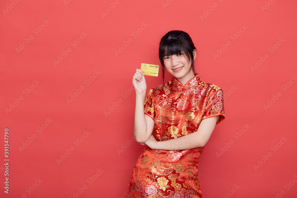 woman wear cheongsam with a credit card shopping woman wear cheongsam with a credit card shopping