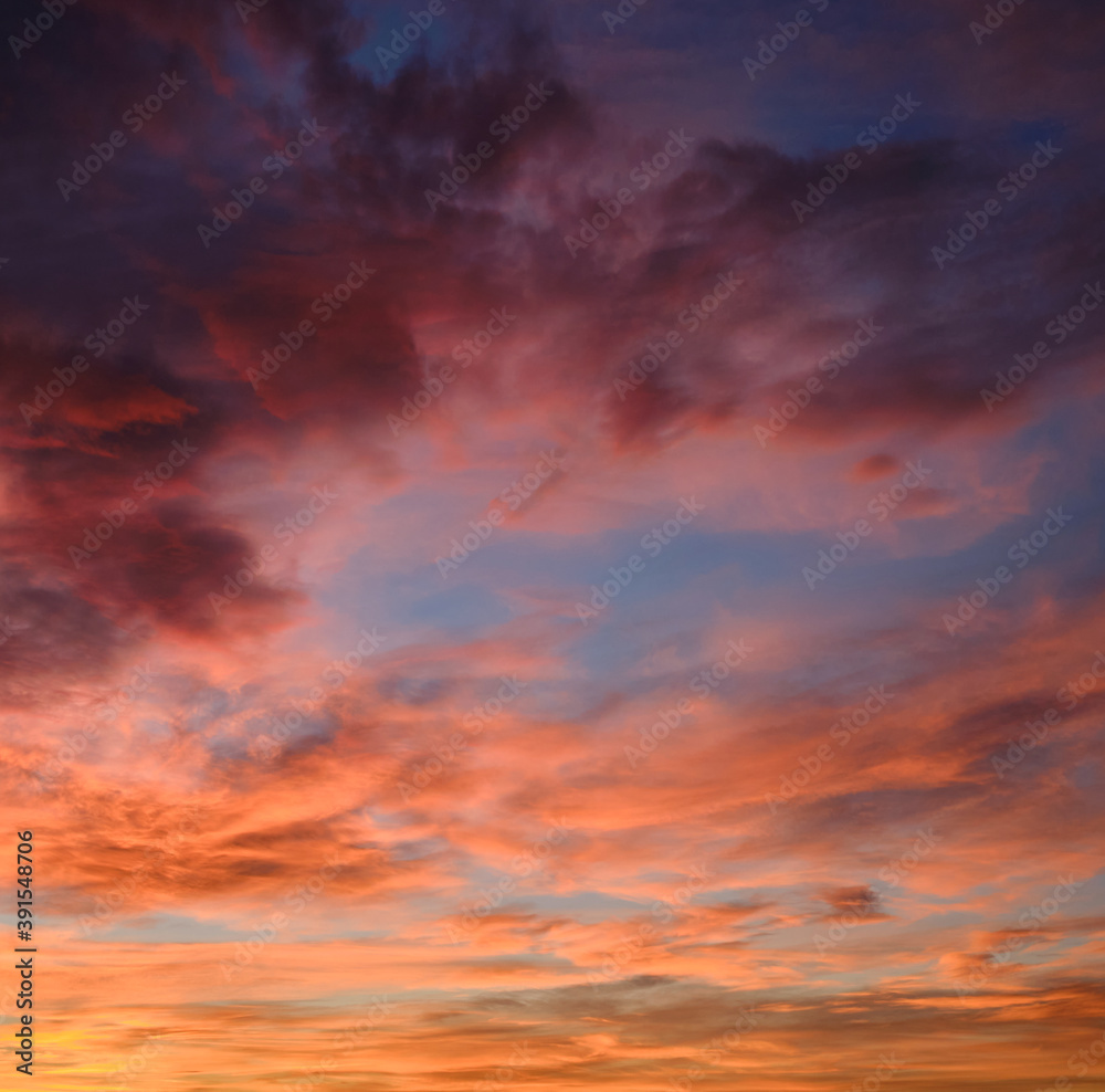 Beautiful multi colored sunset square view. Full frame cloudy sky background