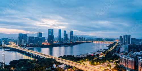 Early morning scenery of CBD cities along Min River in Fuzhou, Fujian, China © Govan