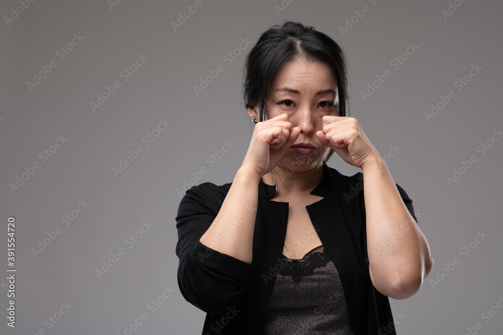 Sorrowful sad Asian woman crying Sorrowful sad Asian woman crying