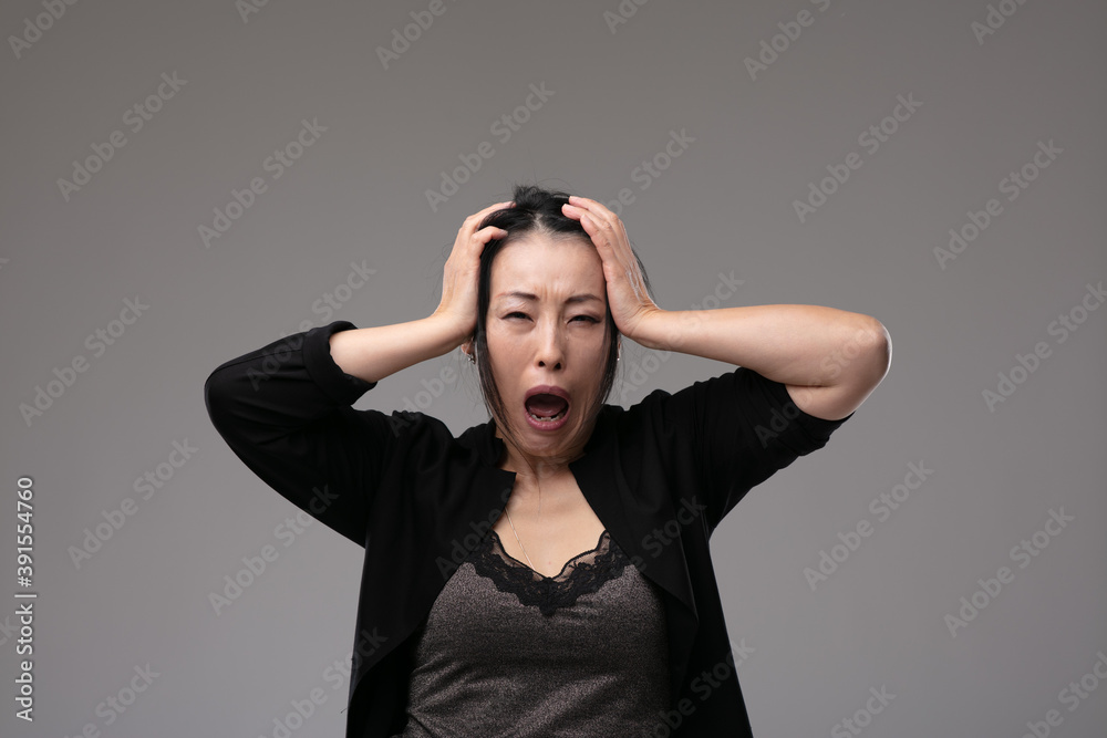 Sorrowful grieving woman wailing in anguish Sorrowful grieving woman wailing in anguish