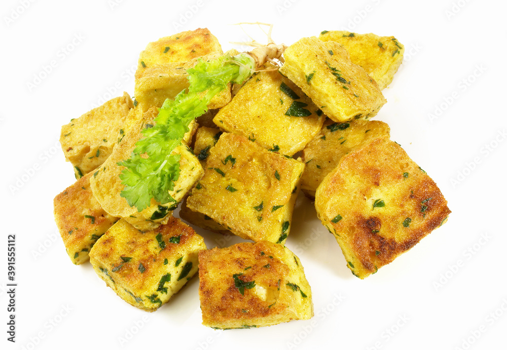 Roasted Tofu Cubes with Curry on white Background - Isolated Roasted Tofu Cubes with Curry on white Background - Isolated