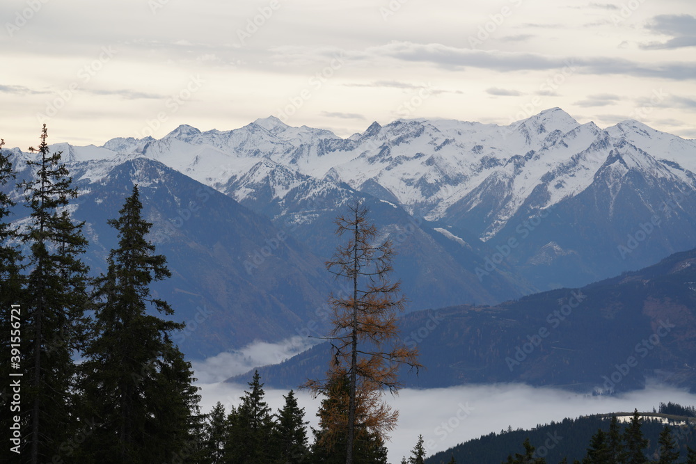 beautiful view in the morning to the snow capped alps in austria in autumn