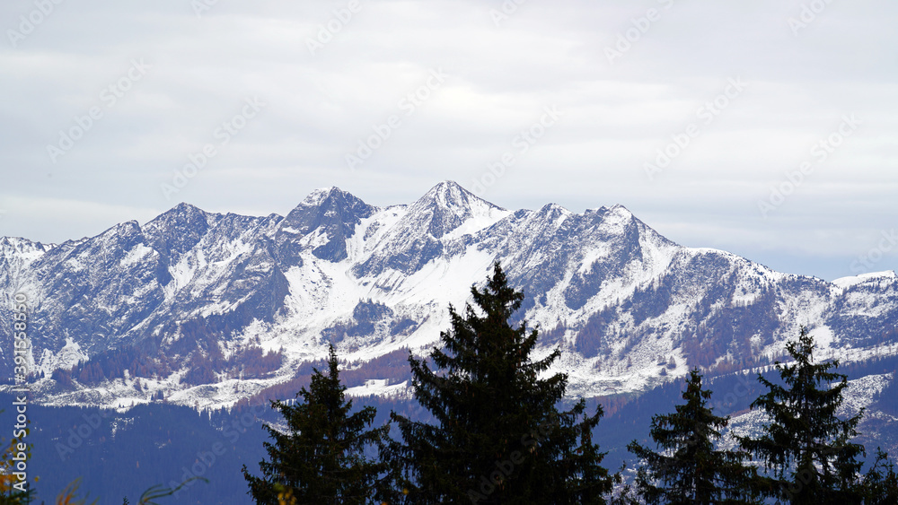 beautiful view in the morning to the snow capped alps in austria in autumn