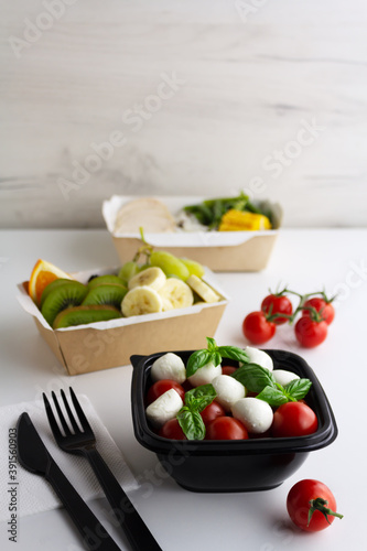Different types of takeaway food on a light background