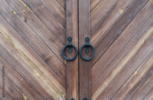 Obraz na plátně antique wooden door with iron ring handle and lock in the monastery building