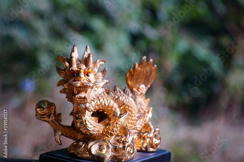 Close-up dragon figurine. A symbol of supernatural power and achievement.