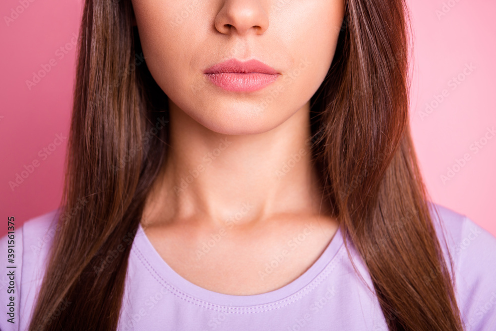Close-up photo portrait of female lips chin neck isolated on pastel pink colored background Close-up photo portrait of female lips chin neck isolated on pastel pink colored background