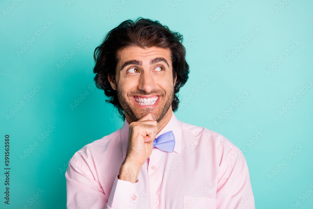 Portrait of positive smiling brunet guy wear tie looking empty space isolated on torques background Portrait of positive smiling brunet guy wear tie looking empty space isolated on torques background