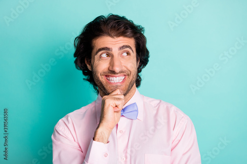 Portrait of positive smiling brunet guy wear tie looking empty space isolated on torques background