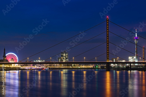 Duesseldorf - Night Shot Of Duesseldorf Rhine Tower With Theodor Heuss Bridge and Rheinkniebrücke In Front, North Rhine Westphalia, Germany, Duesseldorf, 08.11.2019