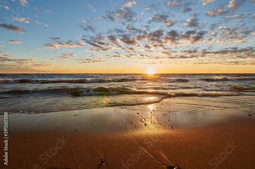 sunset on the sandy beach of the gulf of finland