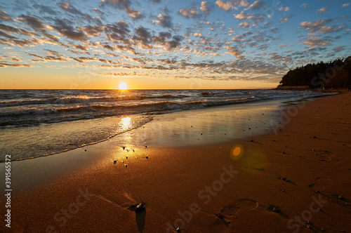 sunset on the sandy beach of the gulf of finland