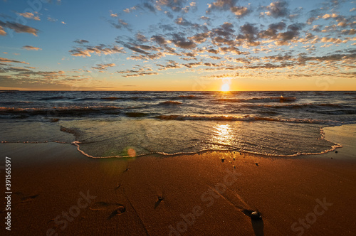 sunset on the sandy beach of the gulf of finland