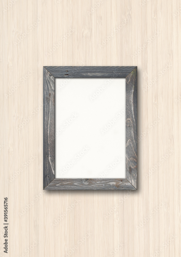 Old rustic wooden picture frame hanging on a wood wall Old rustic wooden picture frame hanging on a wood wall
