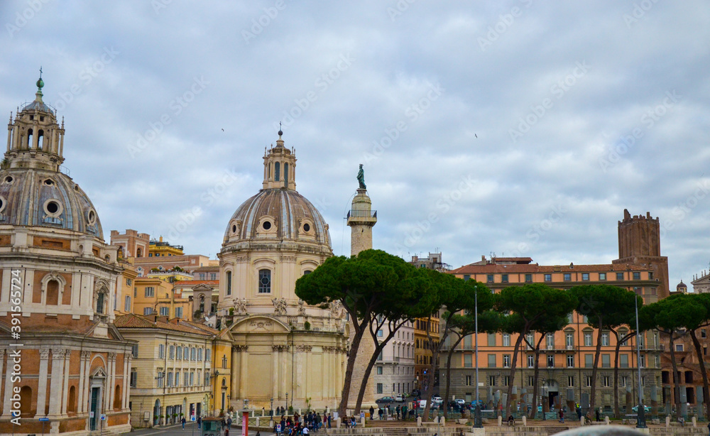 Trajan Column, Catholic churches and pine trees at Piazza Venezia, Rome, Italy