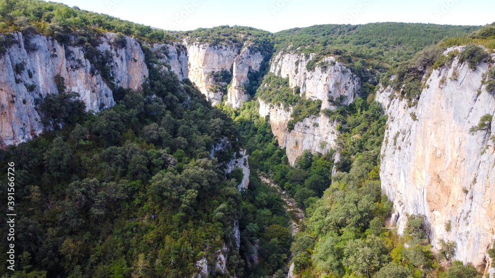 Fototapeta premium Steep canyon surrounding a river