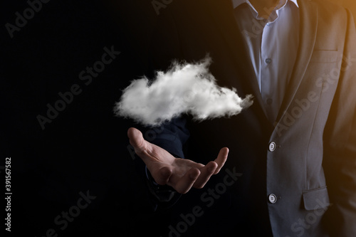 Businessman hand holding cloud.Cloud computing concept, close up of young business man with cloud over his hand.The concept of cloud service.