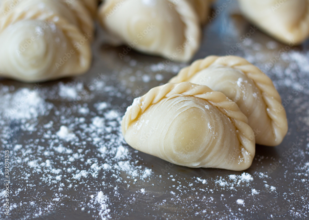 Image selective focus samosas or double curry flour separated as food or dessert snack have a delicious and spicy taste made from bread blue background. Image selective focus samosas or double curry flour separated as food or dessert snack have a delicious and spicy taste made from bread blue background.
