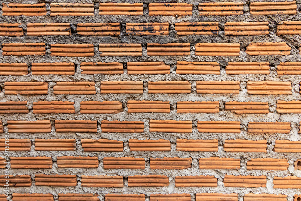 brick walls background and texture. The texture of the brick is orange. Background of empty brick basement wall. brick walls background and texture. The texture of the brick is orange. Background of empty brick basement wall.