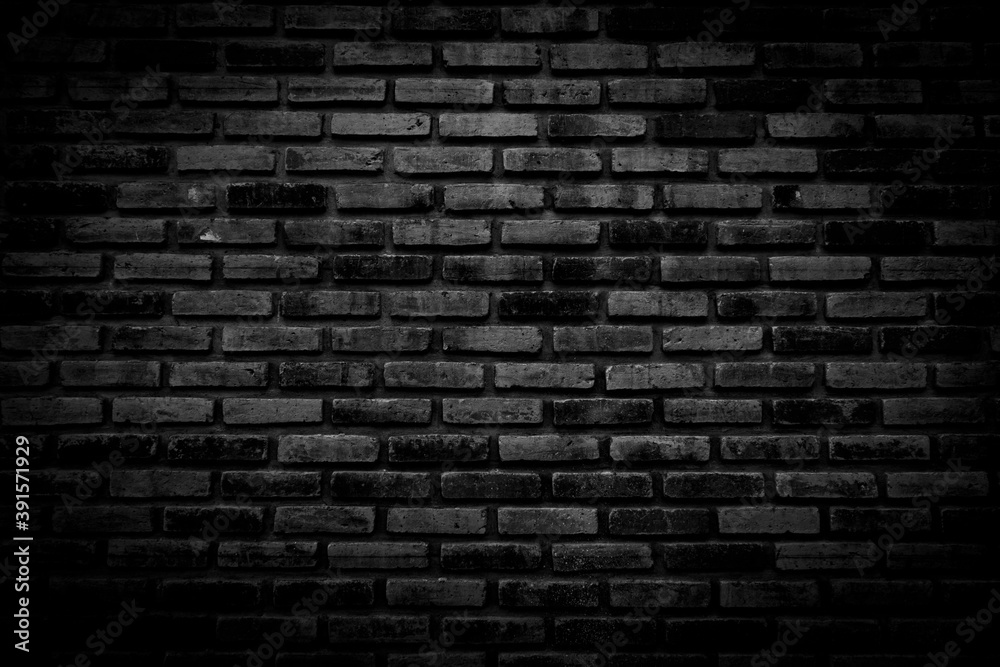 Black brick walls that are not plastered background and texture. The texture of the brick is black. Background of empty brick basement wall.