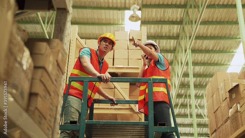 Asian workers use stairs to arrange warehouses on high floors.
Asian workers use stairs to arrange warehouses on high floors.