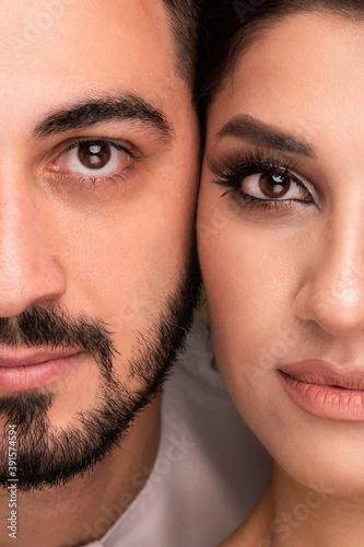 Muslim woman and man. Close up Portrait of a young arab girl and man in traditional dress. 