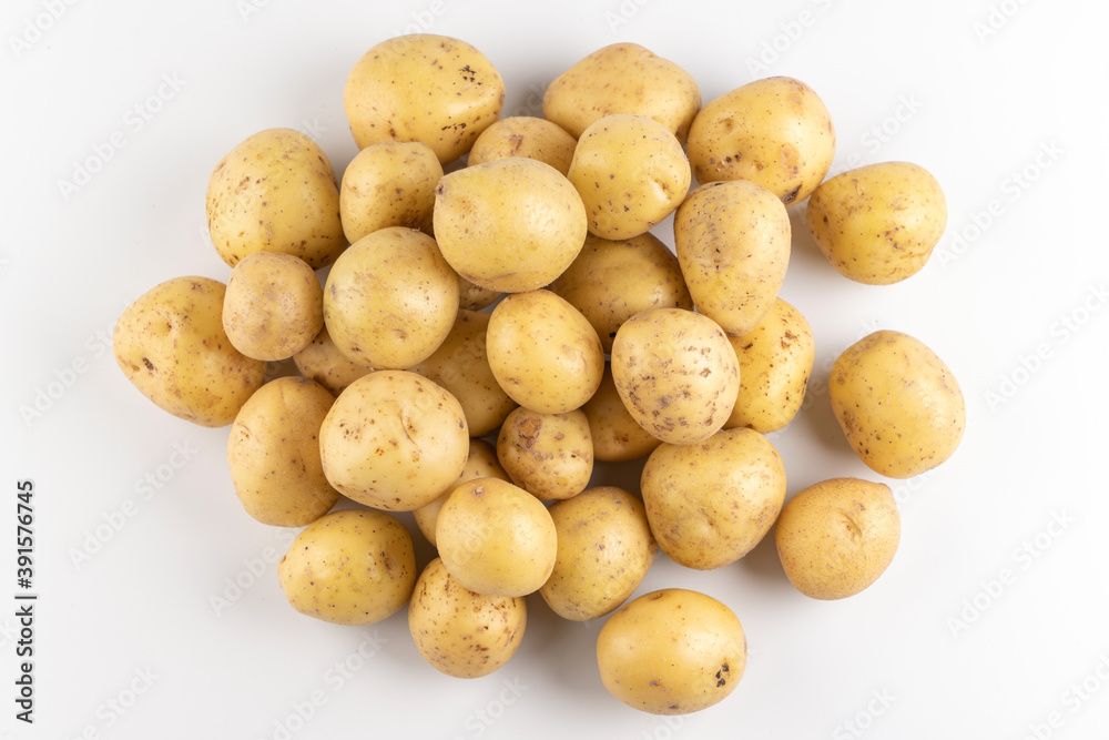New raw potatoes isolated on white background close up, top view, flat lay New raw potatoes isolated on white background close up, top view, flat lay