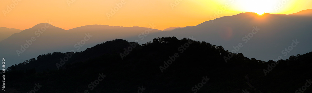 Panoramic sunset over mountains