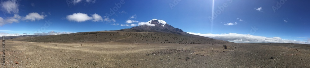 Panoramic view over the plains surrounding the Chimborazo vulcano of Ecuador with the vulcano in the background