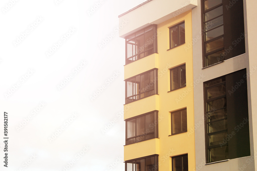 Facade of a new yellow building, modern house Facade of a new yellow building, modern house