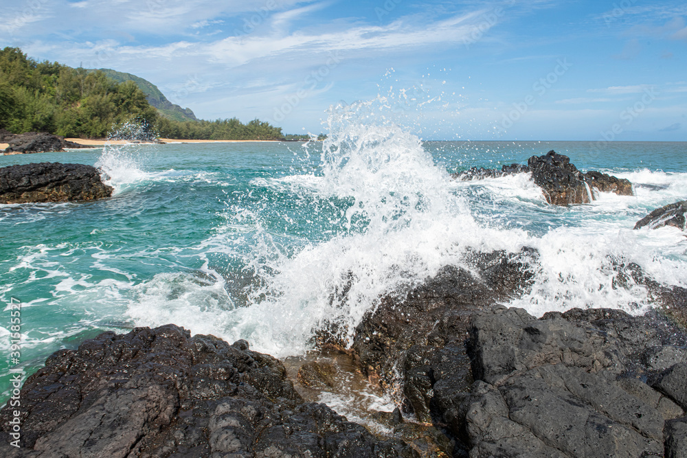 Kauai wave crashing against lava rock