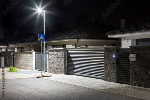 entrance to a modern house with a street lighting pole