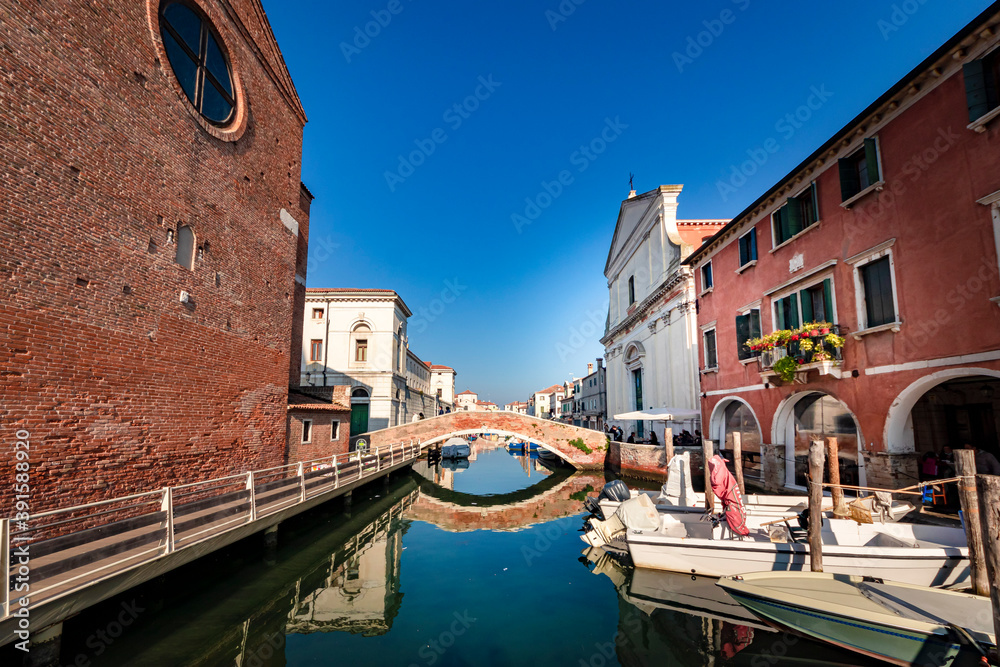 Romantic cityscape of Ghioggia - near Venice - with canals, buidings, bridges and canals in Daylight. Bridge Filippini